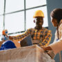 Cheerful people having fun together in warehouse, working on manufacturing products and stock production. Team of workers laughing and planning shipment with goods. Handheld shot. SSUCv3H4sIAAAAAAAAA4VRy47jIBD8F85GwoAN9h/MYaS9R3NooJ2gISYyeEejyP8+7cTZPQ6nflRXVxd3FgMbmZsCgBSG98pKrlEIDm3ruDZBiWHSXWta1rAAFdnYKiWVMbLrrdRK0GuYgxI9G+8sprSWukCNeWYjdRacAy6PEEOseYmQKNsaVirUtWChMco8cZ+p+8hffKf7XieBb3PYafdZGlwdld5j8ZgSzJjXwrbmBf2D+ZbwV9g/ANs+GgZnnP33rmTbJSeEh7ATE8Ja30oyZWo916JD7hwaroxytjMd9G4iqmFonbTKceOt4FoTFnRAHsDIXjpUiAPBfADbd8ZywiLX3WD4YDrLwcEQpIMJ/cRIzudXxeV6OJPrZTeQhOd1rsv3U3zK+QaODh0nSAUbdoFSCBCOAg3elujjfD78Jf/y9RnPue7XPTyo2X/GcKx6fsklUnXfc2frLWUIGI726q6x1le64N+IX//R27b9AGMjLGFQAgAA